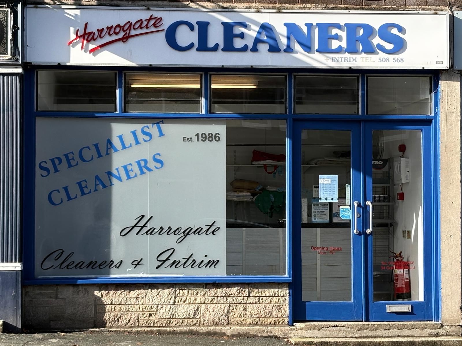 The blue shopfront of Harrogate Cleaners at 34 Cold Bath Road, established 1986