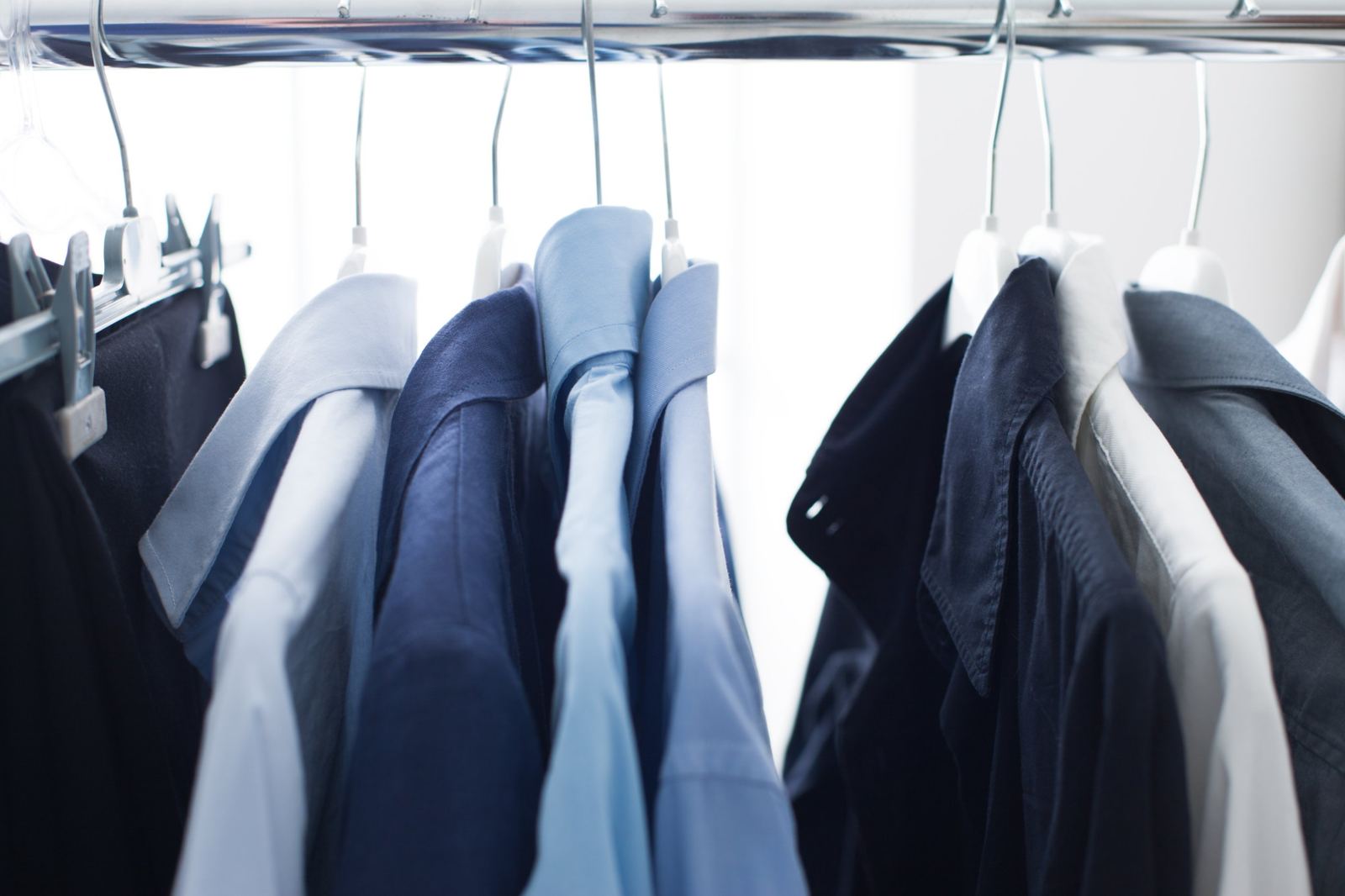 Pressed shirts hanging on a rail
